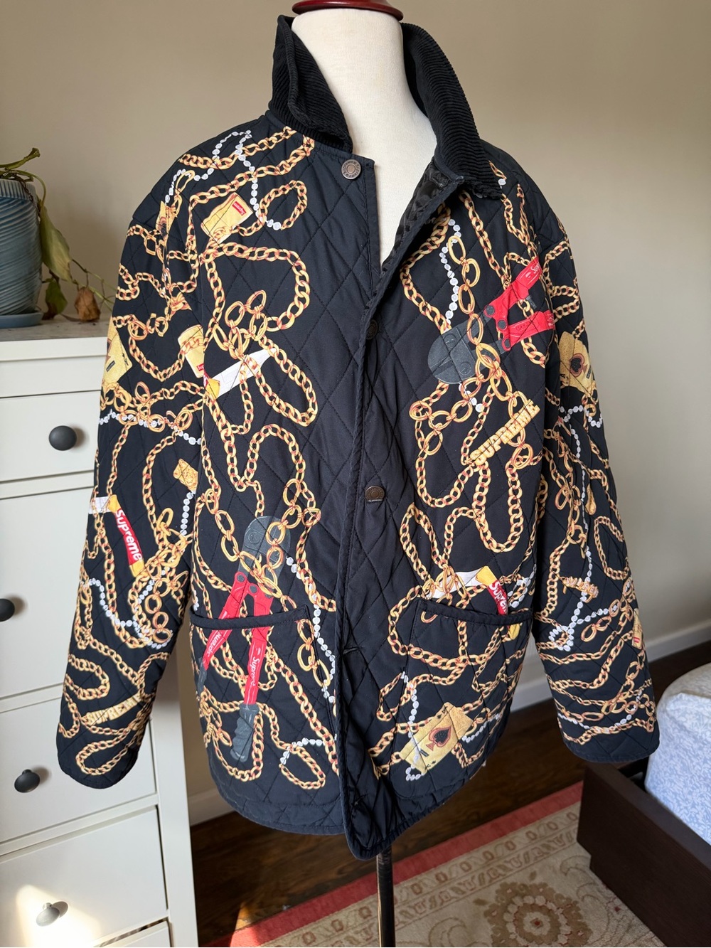 Supreme Black Quilted Jacket with Gold Chain Print
